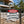 www.cprsigns.com.au Danger Pool Under Construction sign mounted on a black metal fence at a residential building site.
